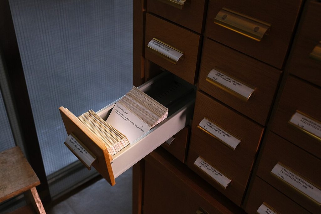 Rows of card catalogue drawers in an archive reading room