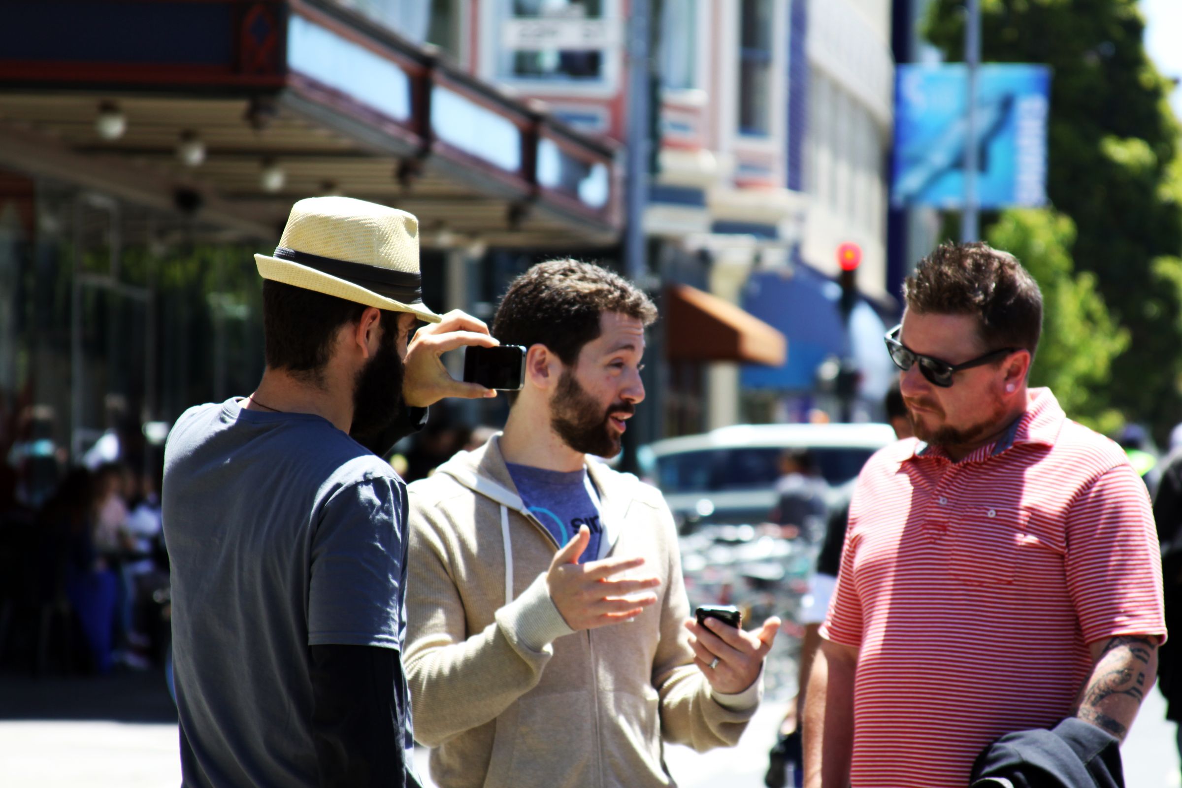 Three men chatting in the street